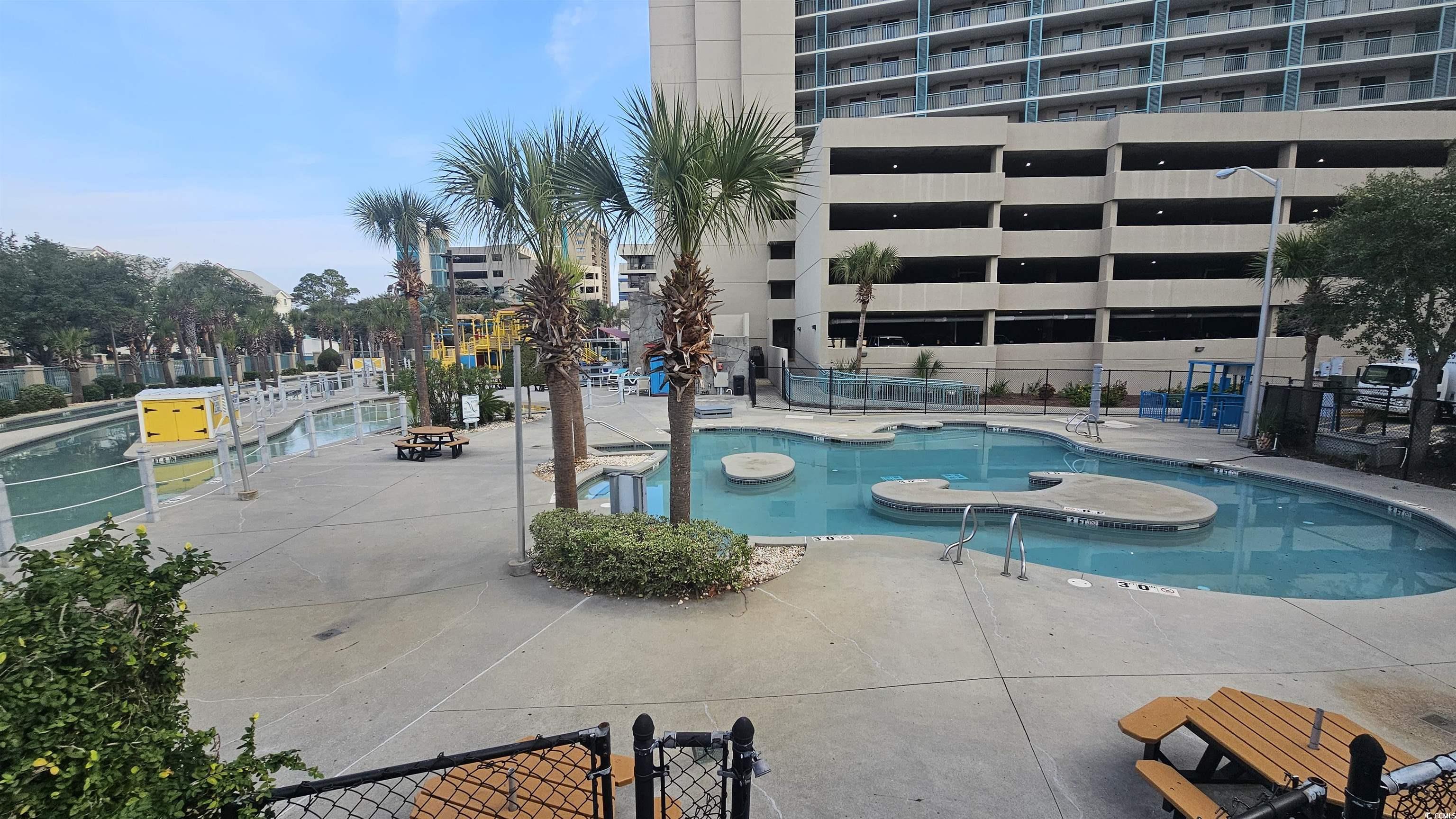 201 74th Avenue North, Unit 1201 Myrtle Beach, SC 29572 - Photo 35 of 40 Community pool with a patio