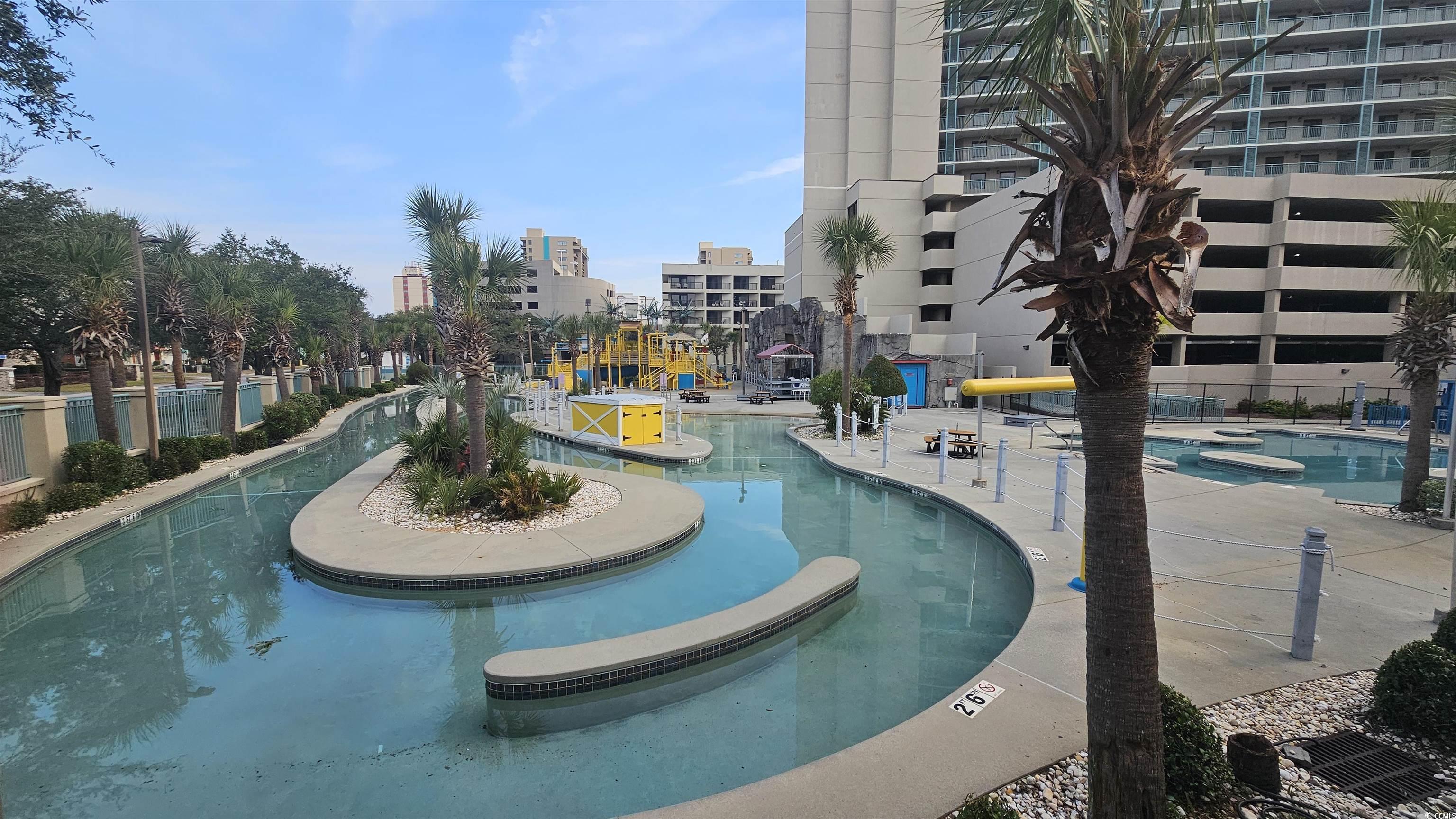 201 74th Avenue North, Unit 1201 Myrtle Beach, SC 29572 - Photo 36 of 40 Community pool with a patio area