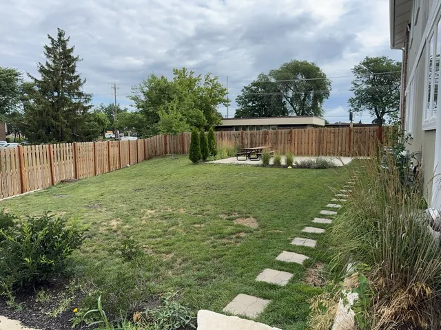 a view of a backyard with a garden