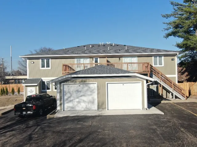 a front view of a house with a garage