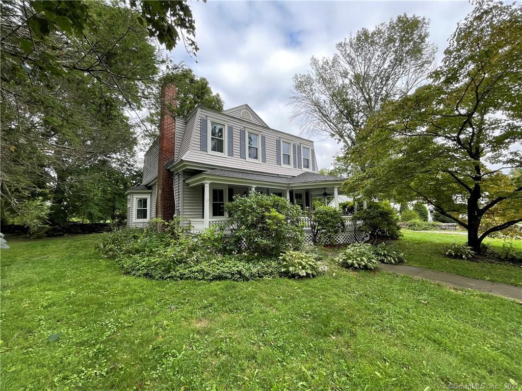 51 Chase Road Thompson, CT 06277 - Photo 1 of 1 a front view of a house with a yard