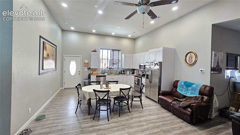 3835 Sengbeil Road Yoder, CO 80864 - Photo 18 of 48 a view of a dining room with furniture and wooden floor