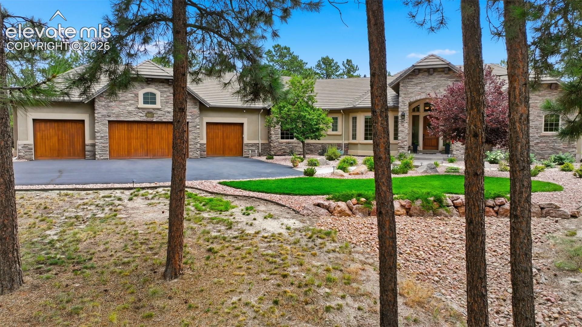 4865 Hidden Rock Road Colorado Springs, CO 80908 - Photo 1 of 50 Lovingly cared for property on over 3 acres in High Forest!