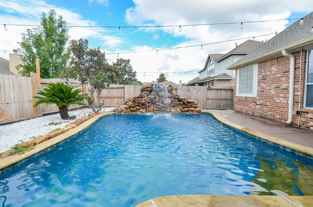 a view of a backyard of the house