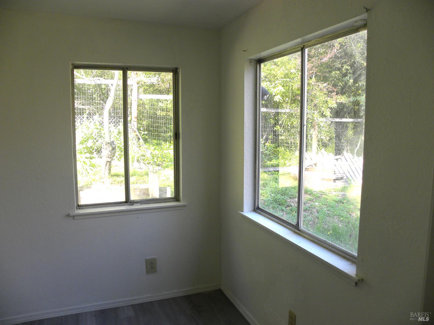 8260 Trenton Road Forestville, CA 95436 - Photo 12 of 24 a view of an empty room with a window