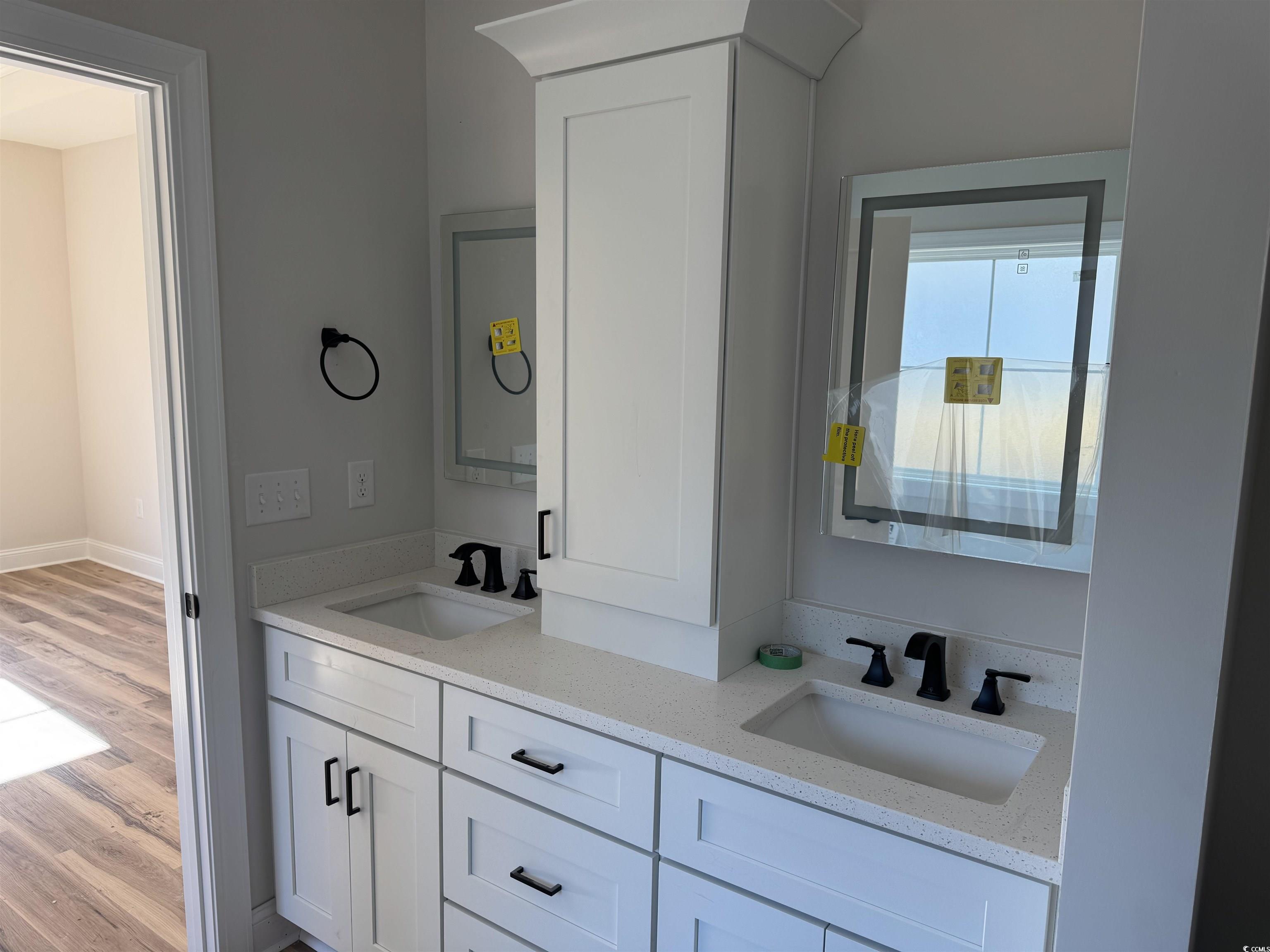 1351 White Oak Lane Galivants Ferry, SC 29544 - Photo 9 of 12 Full bathroom with double vanity and light wood-type flooring