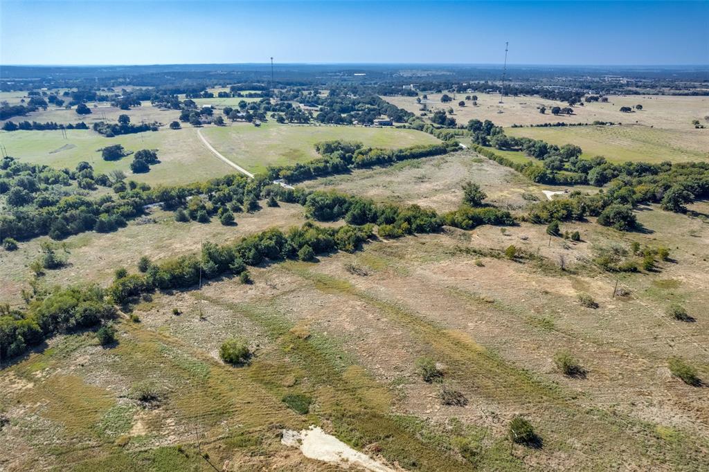 1879 C R 151 Gainesville, TX 76240 - Photo 2 of 8 an aerial view of a houses with a lake view