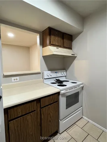 a kitchen with a stove and a sink