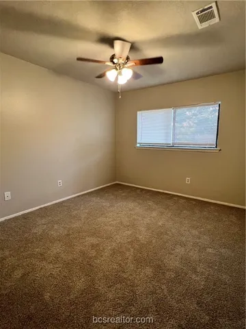 a view of a room with a fan