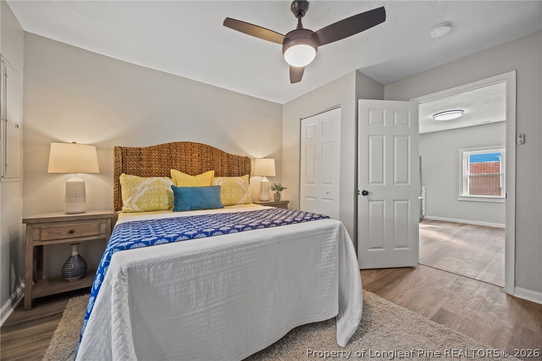 625 Eva Circle Spring Lake, NC 28390 - Photo 19 of 28 a spacious bedroom with a bed and a walk in closet