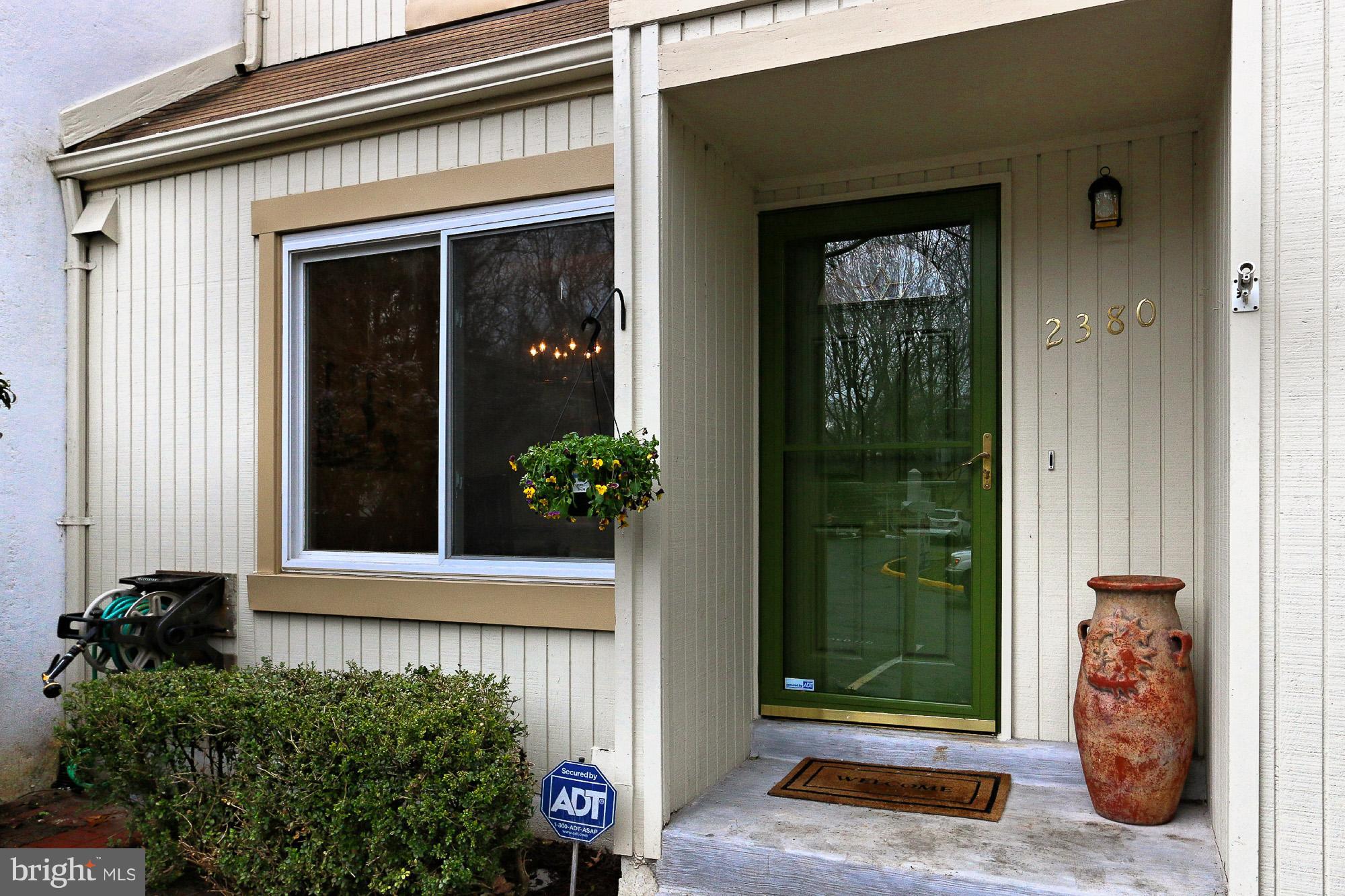 2380 Generation Drive Reston, VA 20191 - Photo 2 of 30 front view of door with a potted plant