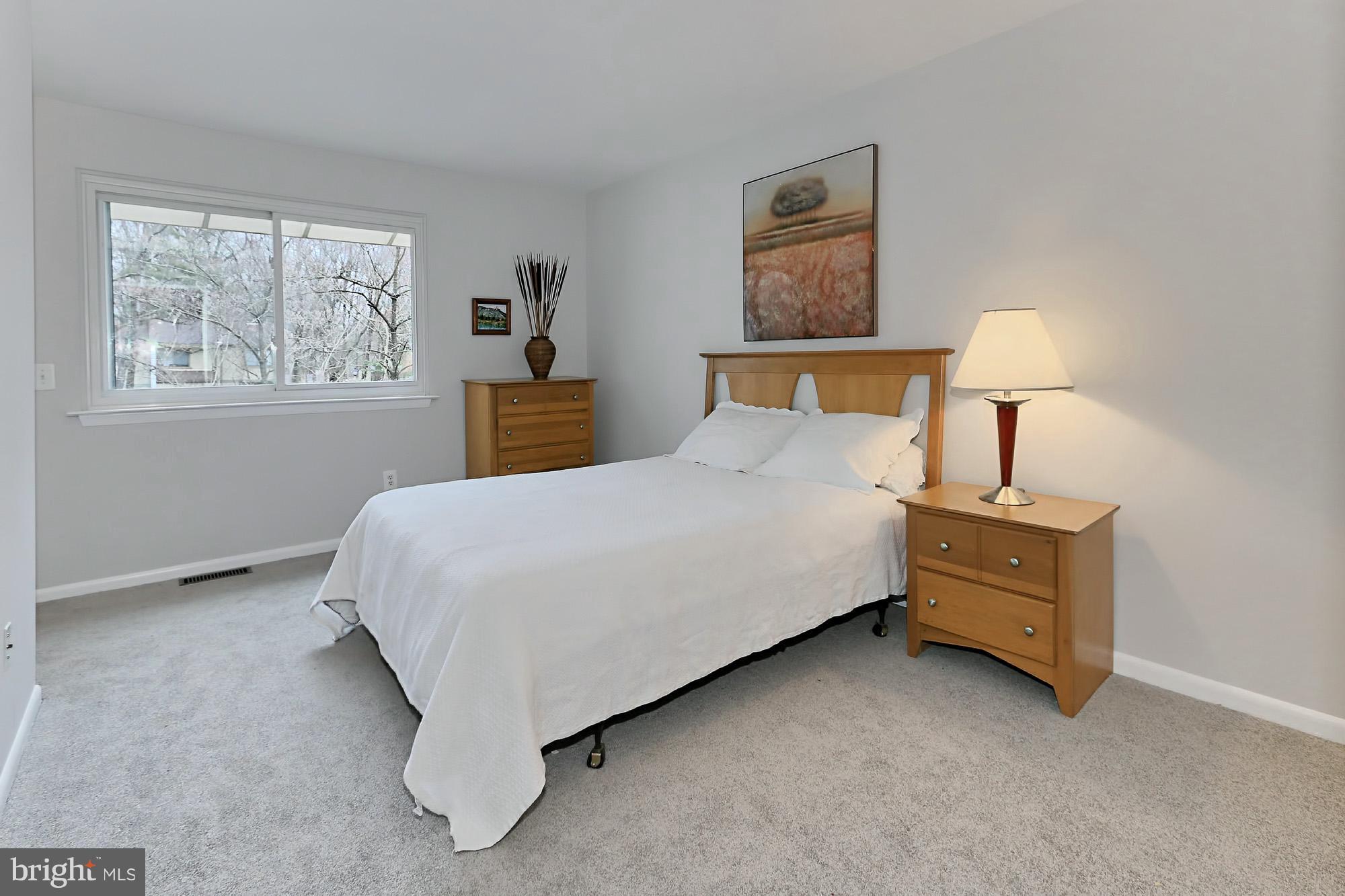 2380 Generation Drive Reston, VA 20191 - Photo 15 of 30 a bedroom with a bed and window