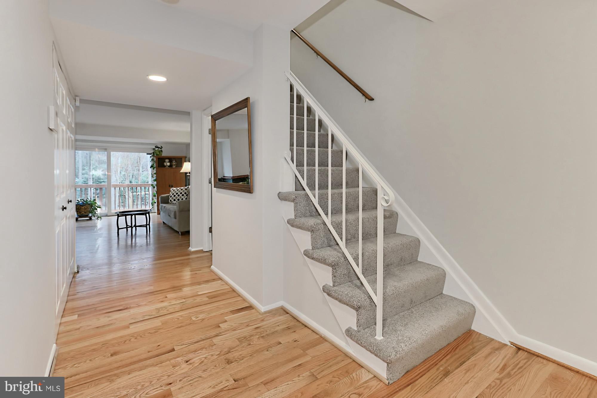 2380 Generation Drive Reston, VA 20191 - Photo 3 of 30 a view of entryway and hall with wooden floor