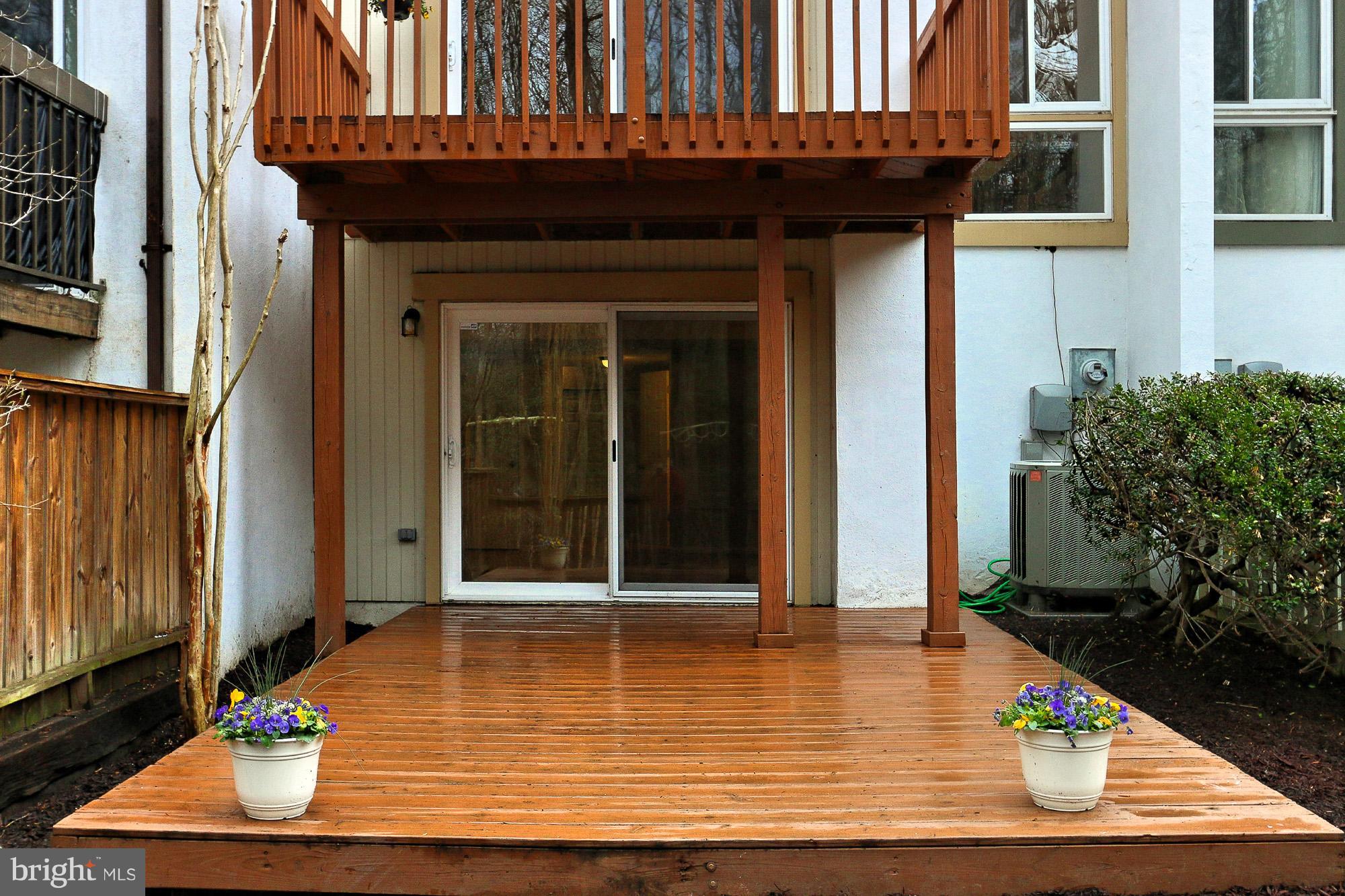 2380 Generation Drive Reston, VA 20191 - Photo 26 of 30 a view of a balcony with door and wooden floor