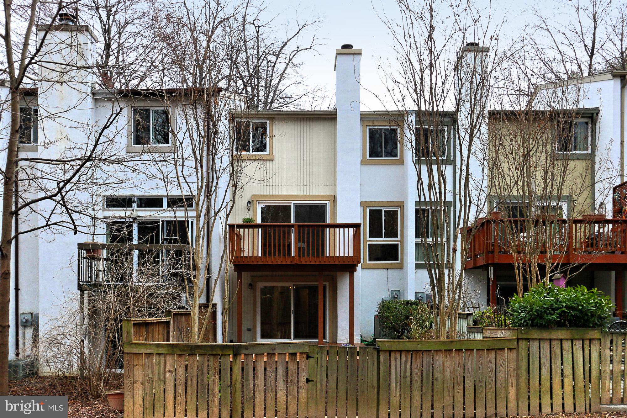2380 Generation Drive Reston, VA 20191 - Photo 29 of 30 a front view of a house with glass windows and a tree