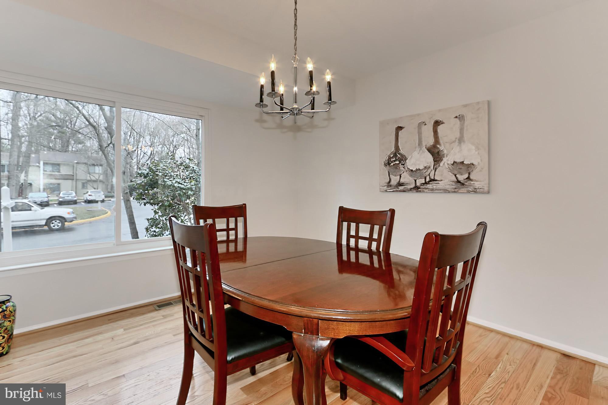 2380 Generation Drive Reston, VA 20191 - Photo 4 of 30 a view of a dining room with furniture window and wooden floor
