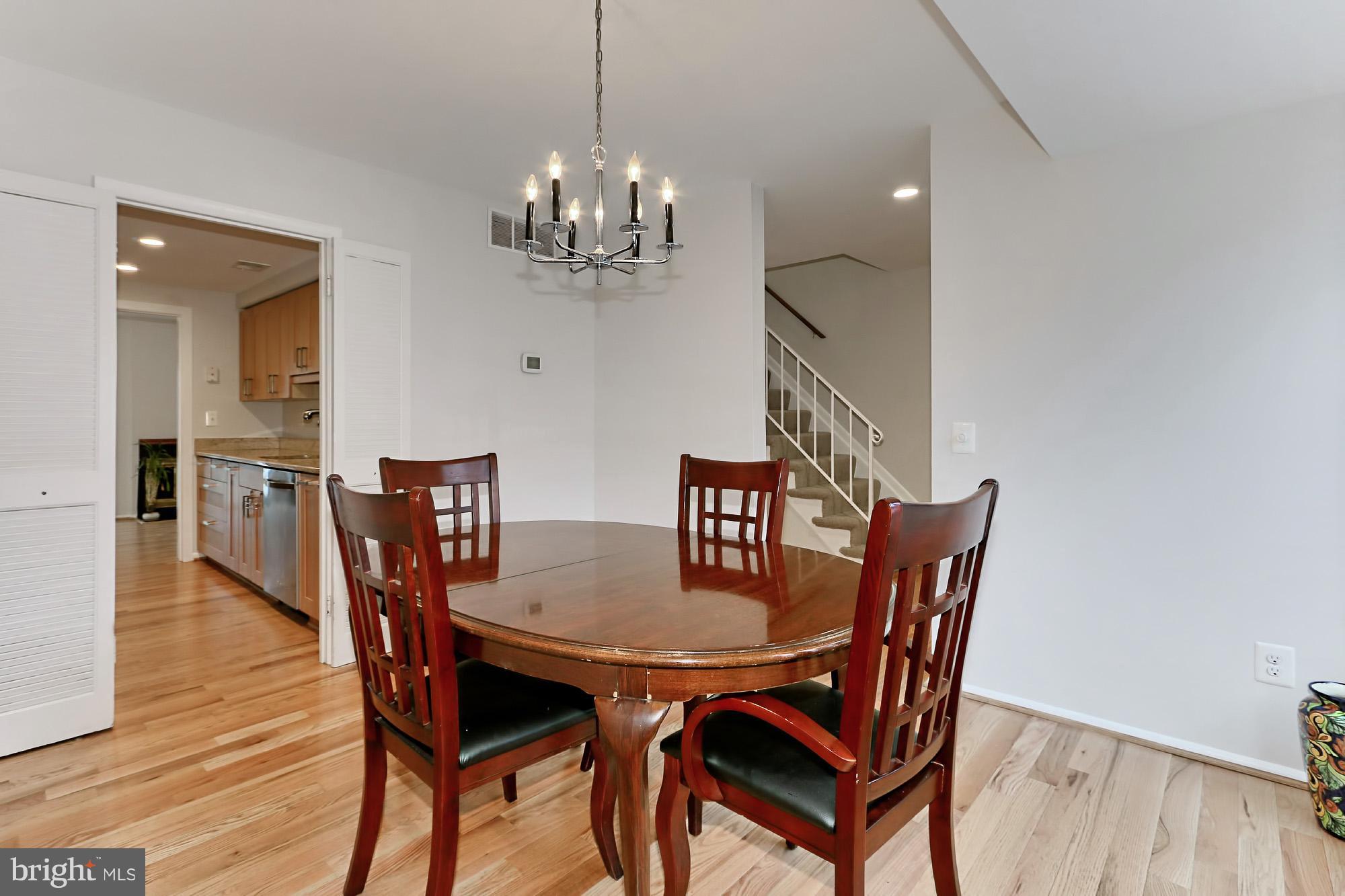 2380 Generation Drive Reston, VA 20191 - Photo 5 of 30 a view of a dining room with furniture and wooden floor
