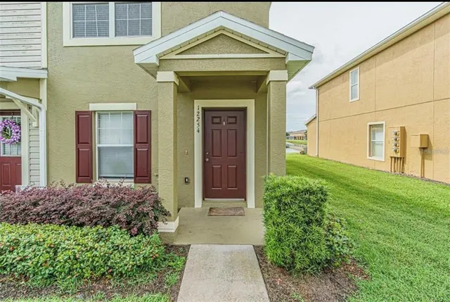 a front view of a house with garden