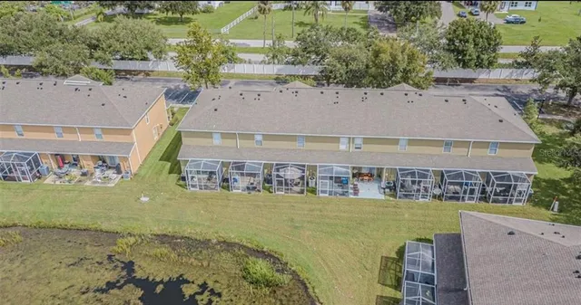 an aerial view of a house with a ocean view