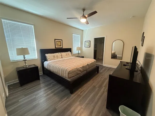 a bedroom with a bed and a dresser