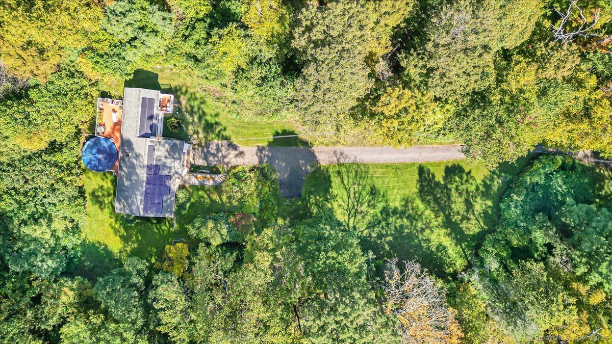 153 Short Woods Road New Fairfield, CT 06812 - Photo 13 of 38 a view of a multi story yard with large trees