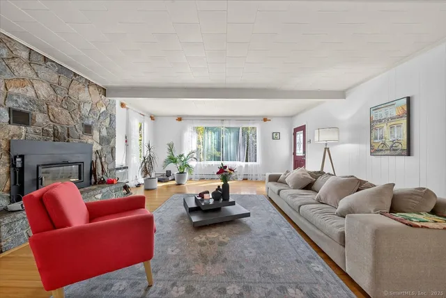 a living room with furniture or couch and a window