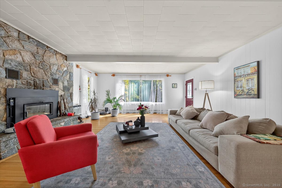 153 Short Woods Road New Fairfield, CT 06812 - Photo 15 of 38 a living room with furniture or couch and a window
