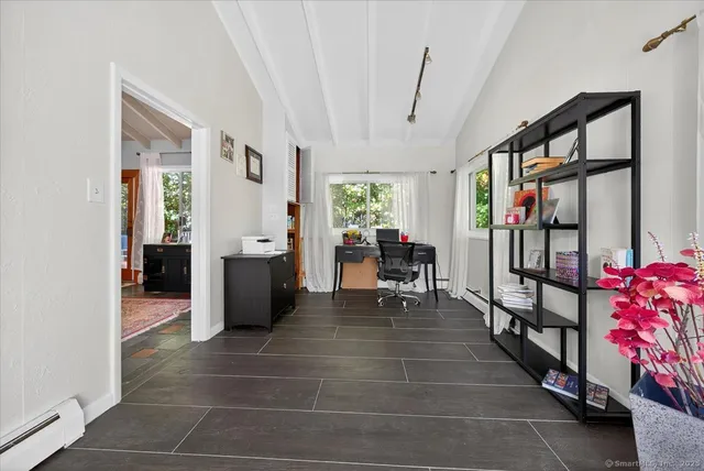 a room with furniture and white walls