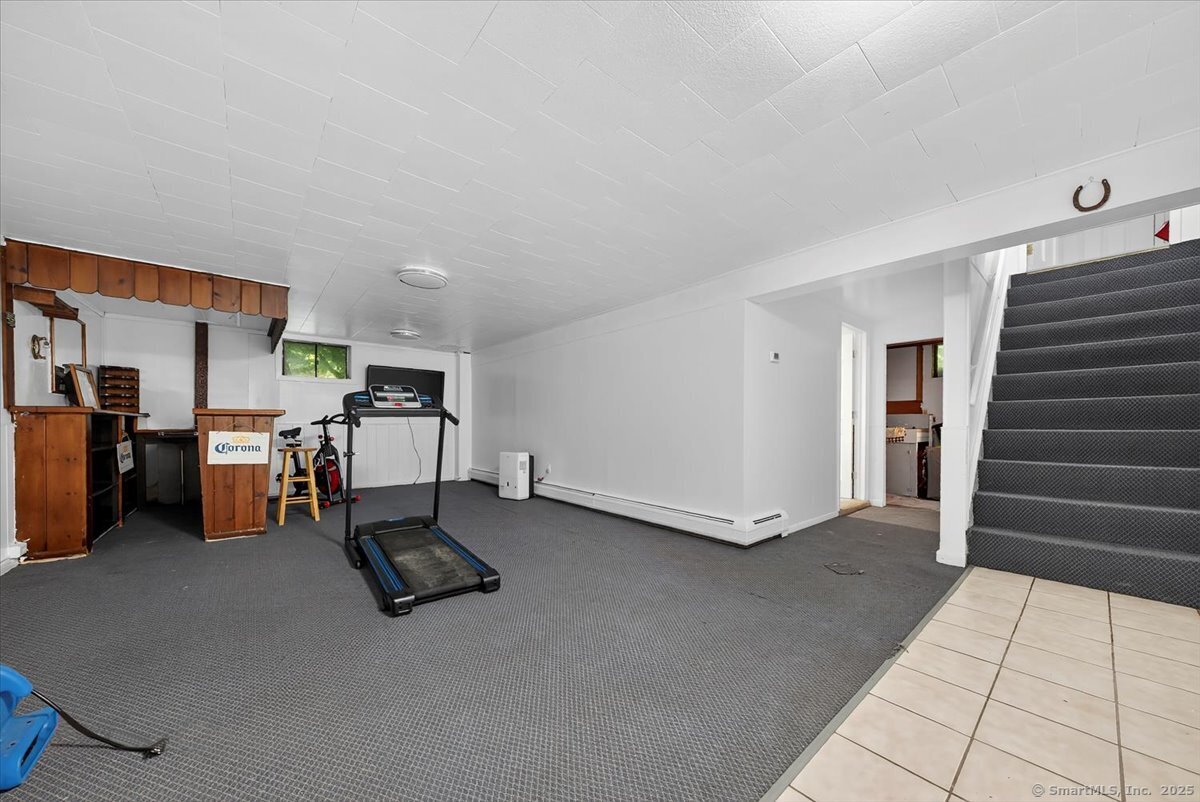 153 Short Woods Road New Fairfield, CT 06812 - Photo 19 of 38 a room with furniture and white walls