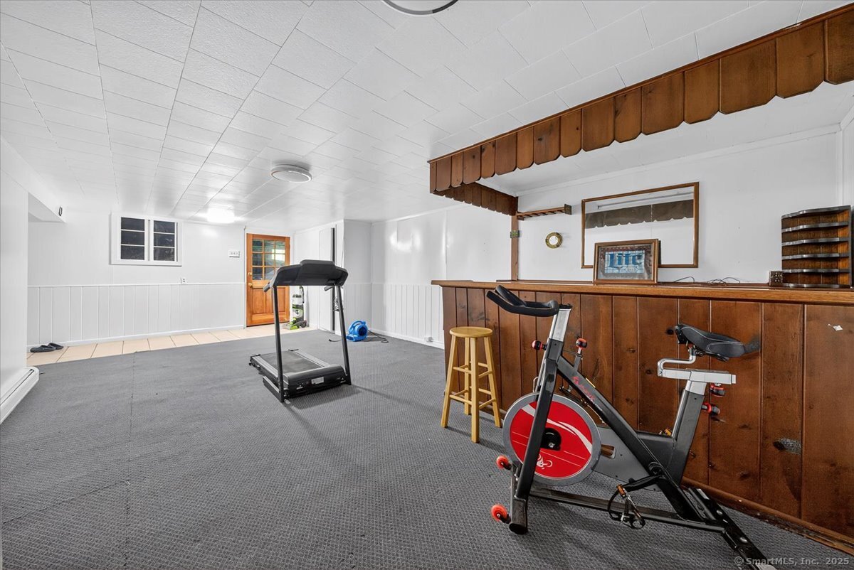 153 Short Woods Road New Fairfield, CT 06812 - Photo 20 of 38 a view of a room with gym equipment