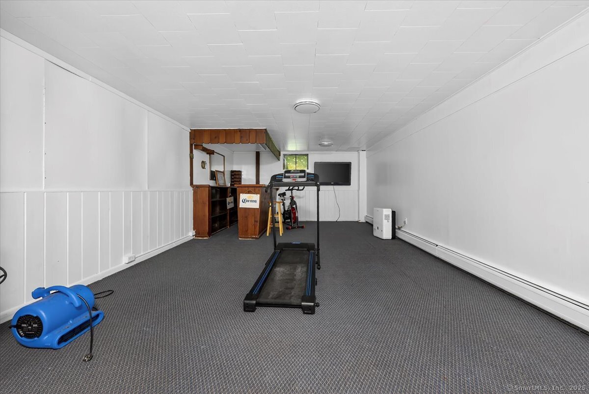 153 Short Woods Road New Fairfield, CT 06812 - Photo 21 of 38 a view of a room with gym equipment