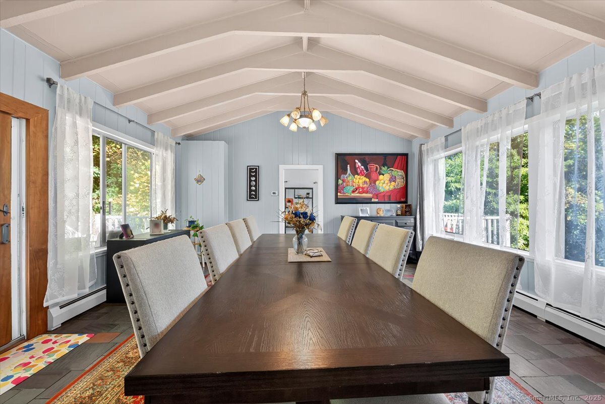 153 Short Woods Road New Fairfield, CT 06812 - Photo 28 of 38 a view of a dining room with furniture wooden floor and chandelier