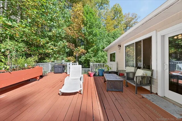 a view of a field of grass and trees