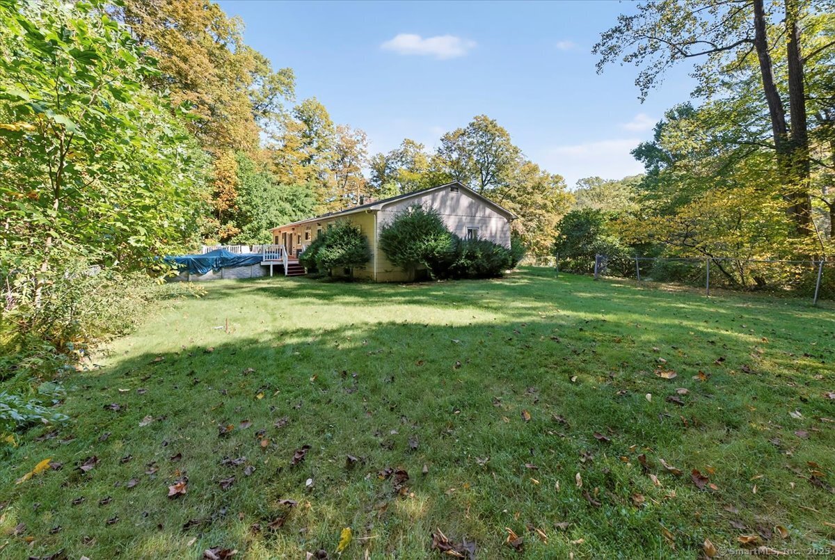 153 Short Woods Road New Fairfield, CT 06812 - Photo 34 of 38 a view of a field of grass and trees