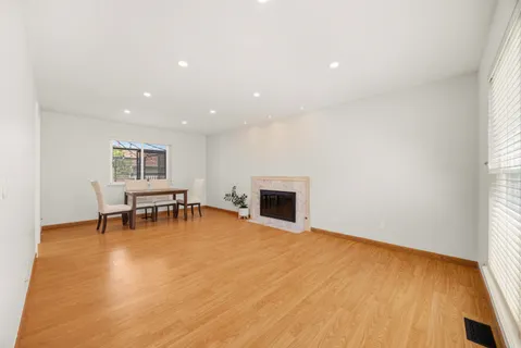 a view of dining room with furniture and fireplace
