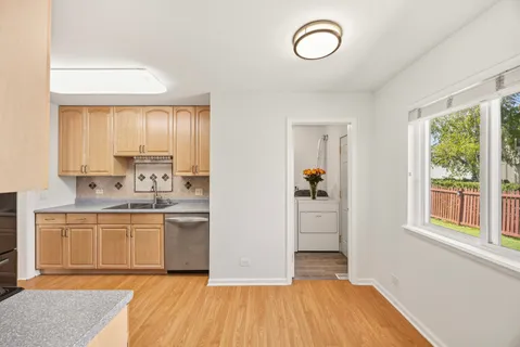a kitchen with a refrigerator and a sink