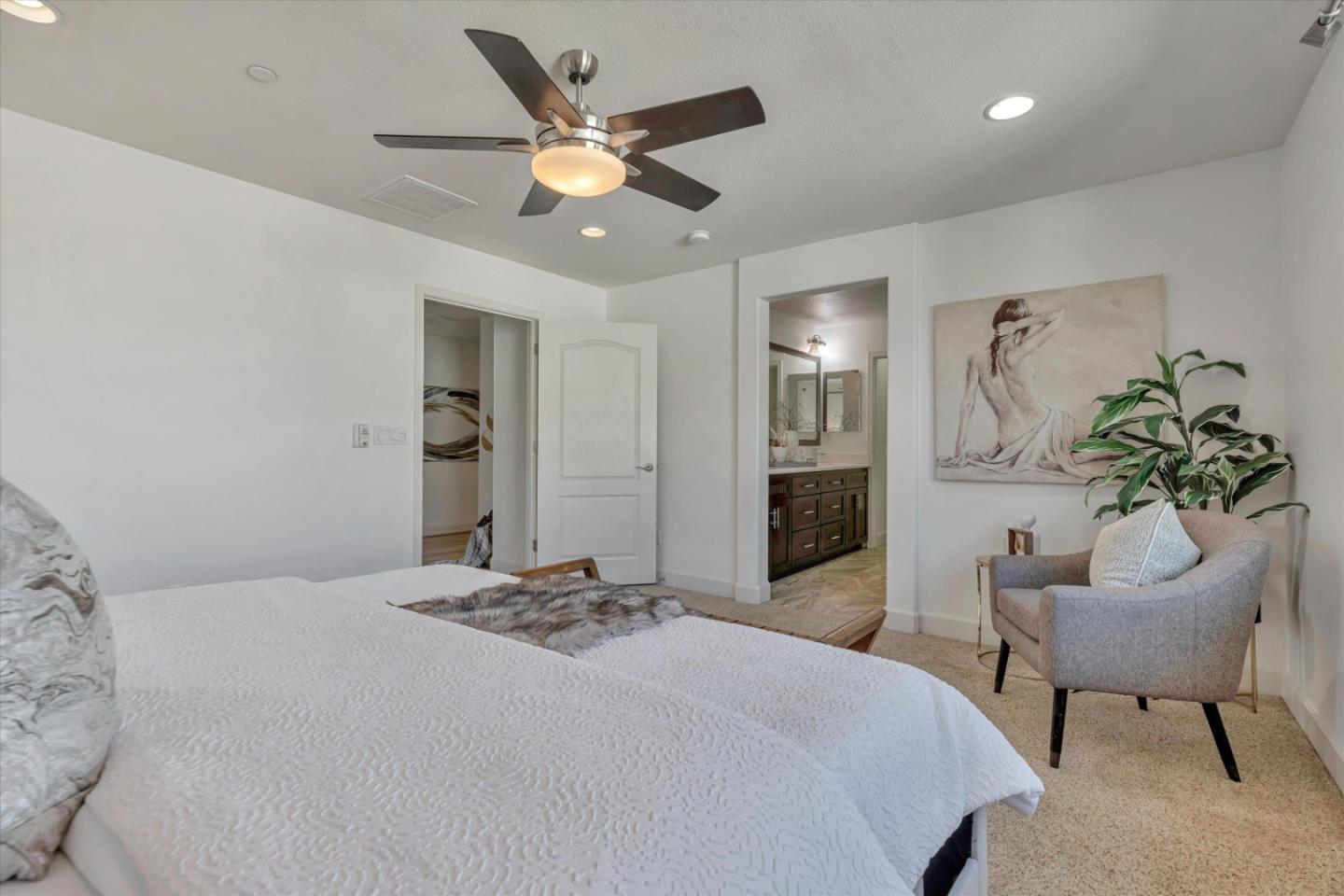 130 Palomino Place Gilroy, CA 95020 - Photo 23 of 50 a bedroom with a bed and a chandelier