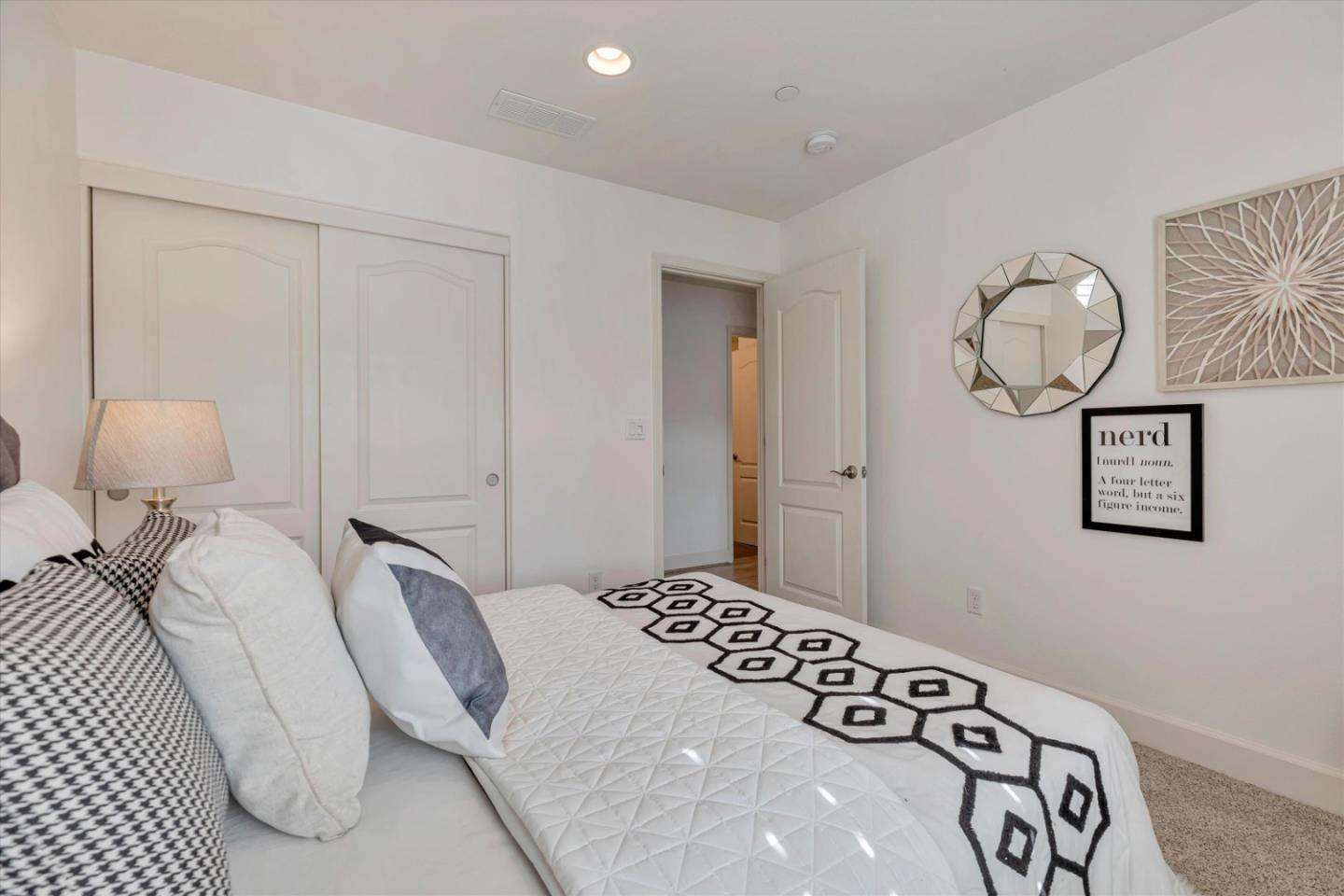 130 Palomino Place Gilroy, CA 95020 - Photo 25 of 50 a bedroom with a bed and lamp