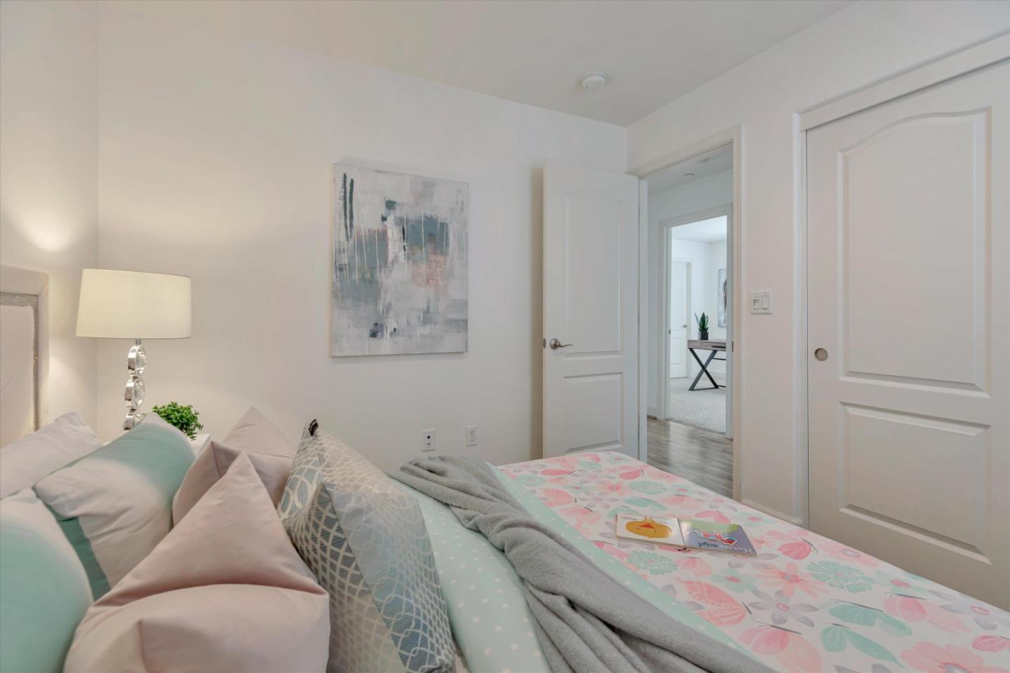 130 Palomino Place Gilroy, CA 95020 - Photo 27 of 50 a bedroom with a bed and a lamp