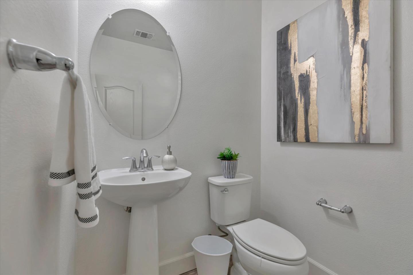 130 Palomino Place Gilroy, CA 95020 - Photo 30 of 50 a bathroom with a toilet a sink and mirror