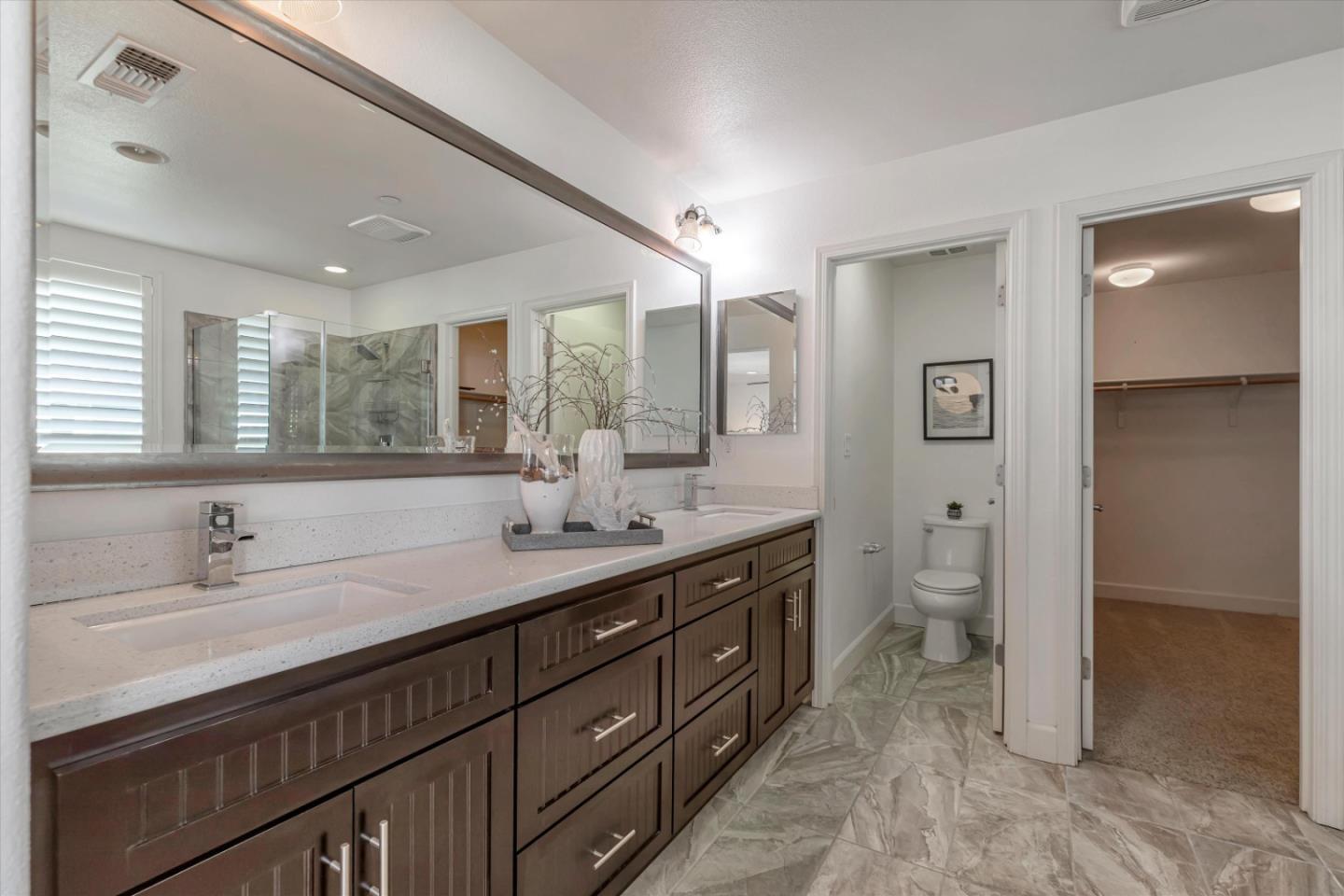 130 Palomino Place Gilroy, CA 95020 - Photo 31 of 50 a spacious bathroom with a granite countertop sink mirror and toilet