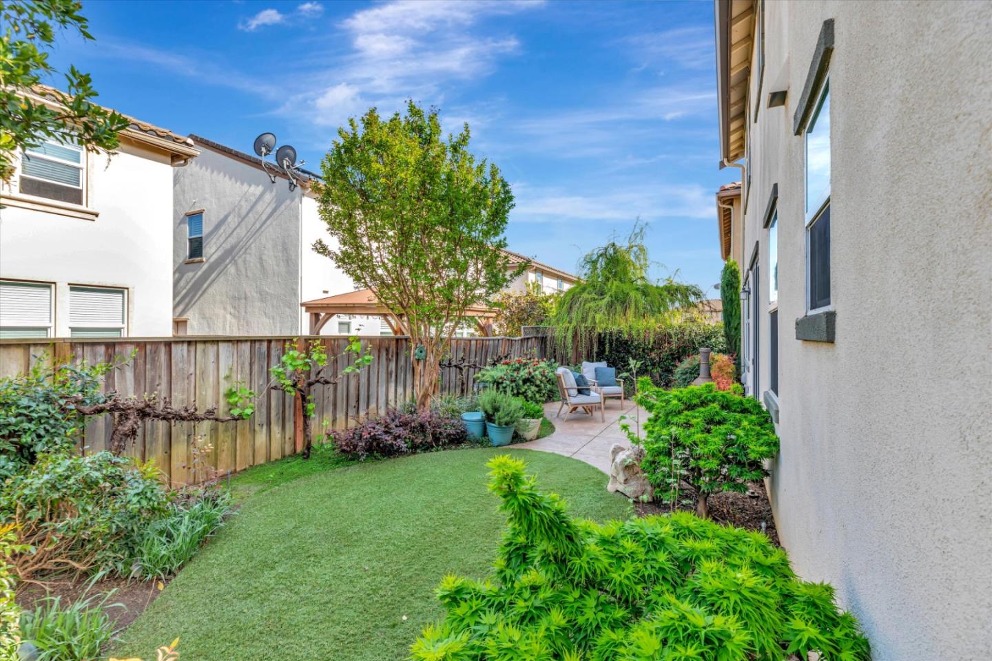 130 Palomino Place Gilroy, CA 95020 - Photo 38 of 50 a view of a house with a small yard and wooden fence