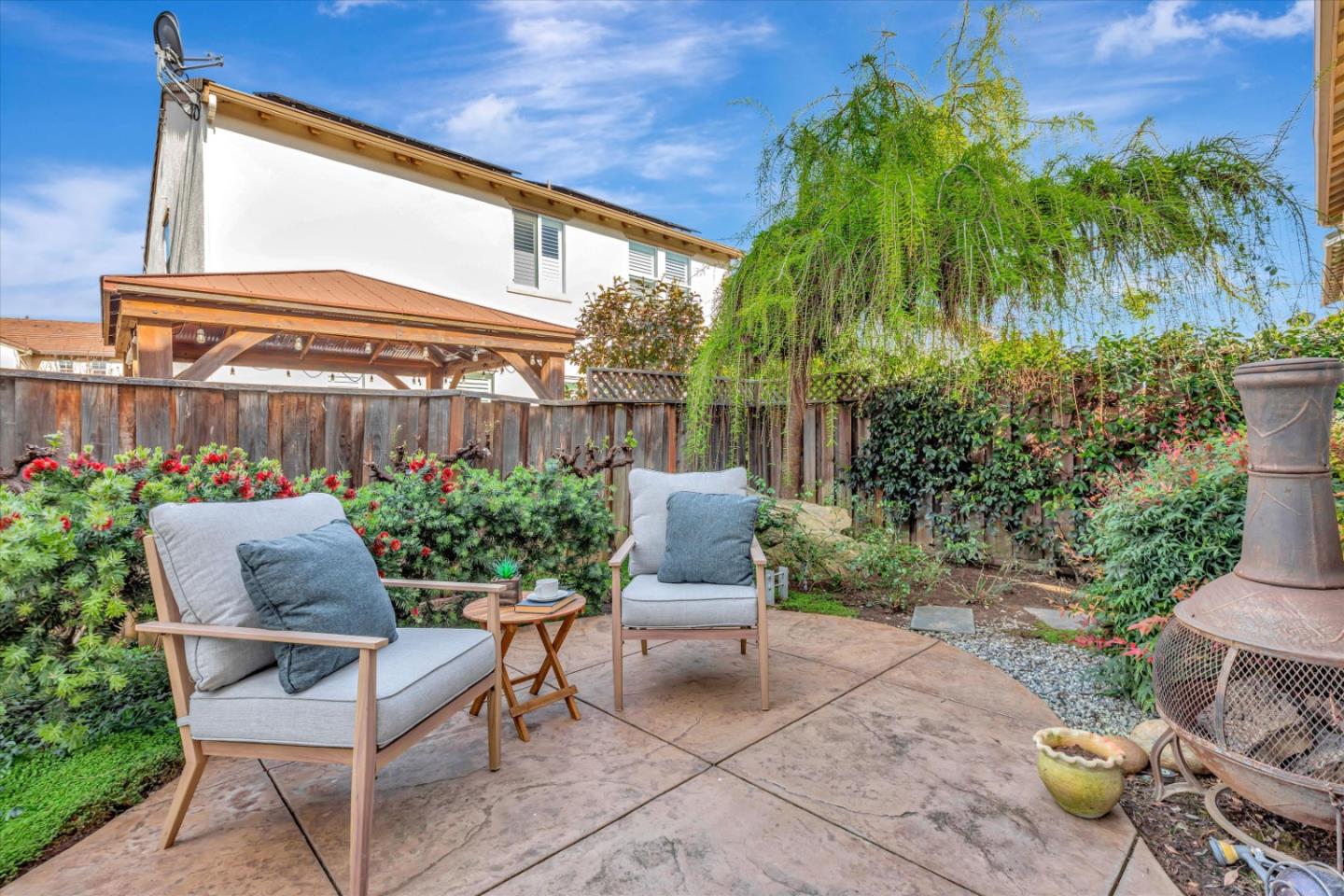 130 Palomino Place Gilroy, CA 95020 - Photo 40 of 50 a view of a patio with table and chairs and potted plants