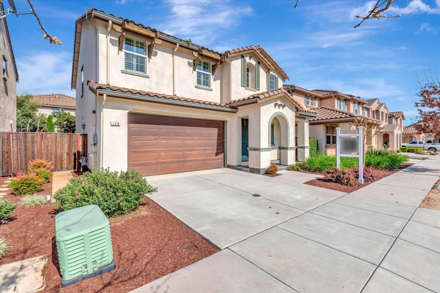 130 Palomino Place Gilroy, CA 95020 - Photo 4 of 50 a front view of a house with a garden