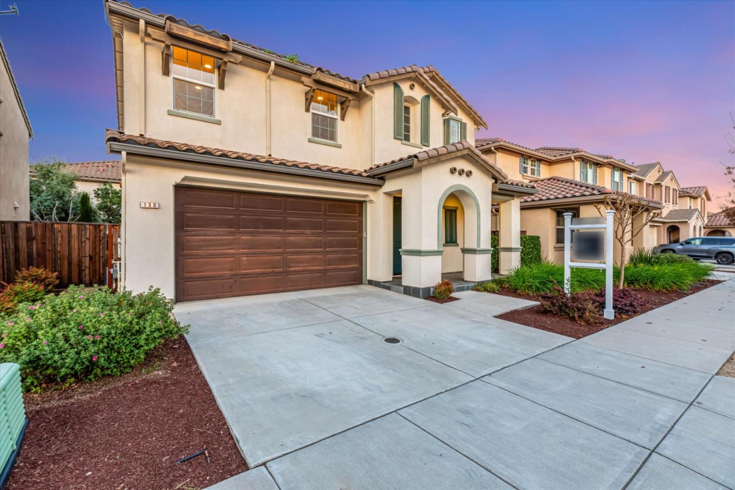 130 Palomino Place Gilroy, CA 95020 - Photo 41 of 50 a front view of a house with a yard and garage