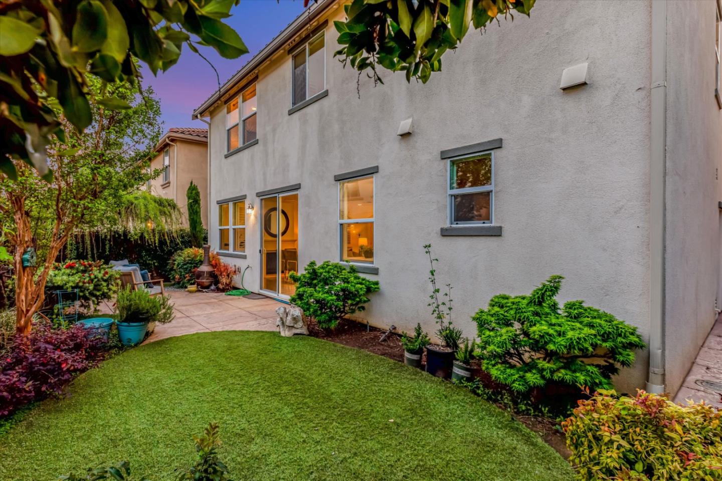 130 Palomino Place Gilroy, CA 95020 - Photo 46 of 50 a front view of a house with a yard and potted plants