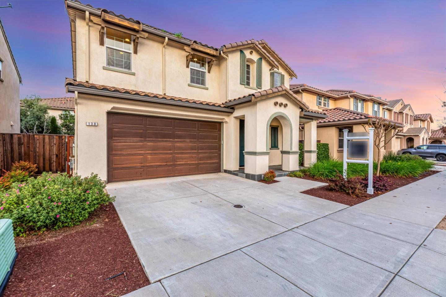 130 Palomino Place Gilroy, CA 95020 - Photo 7 of 50 a front view of a house with a yard and garage