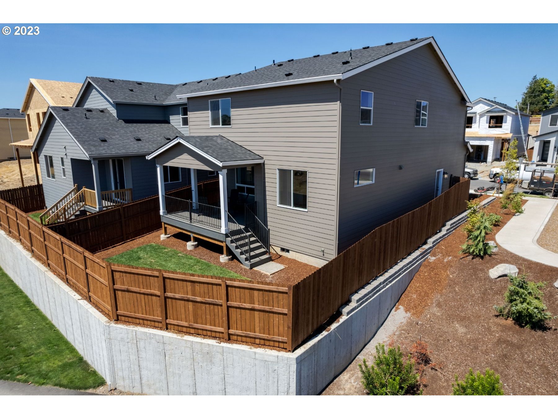 809 Northwest 178th Street Ridgefield, WA 98642 - Photo 25 of 25 a view of a house with wooden fence
