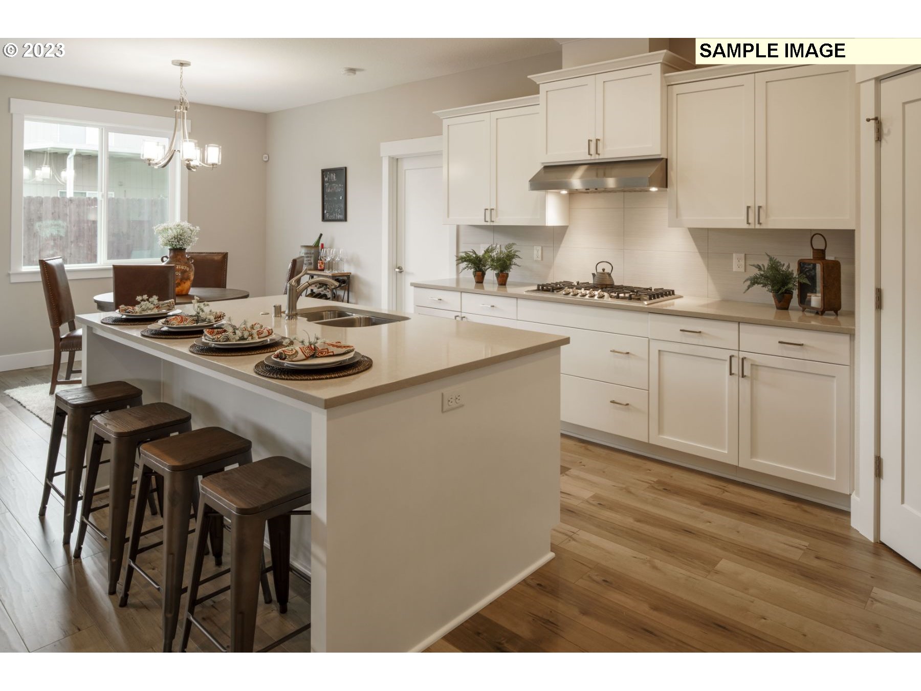 809 Northwest 178th Street Ridgefield, WA 98642 - Photo 8 of 25 a kitchen with a sink cabinets and wooden floor