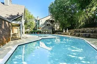 a view of a swimming pool with a patio